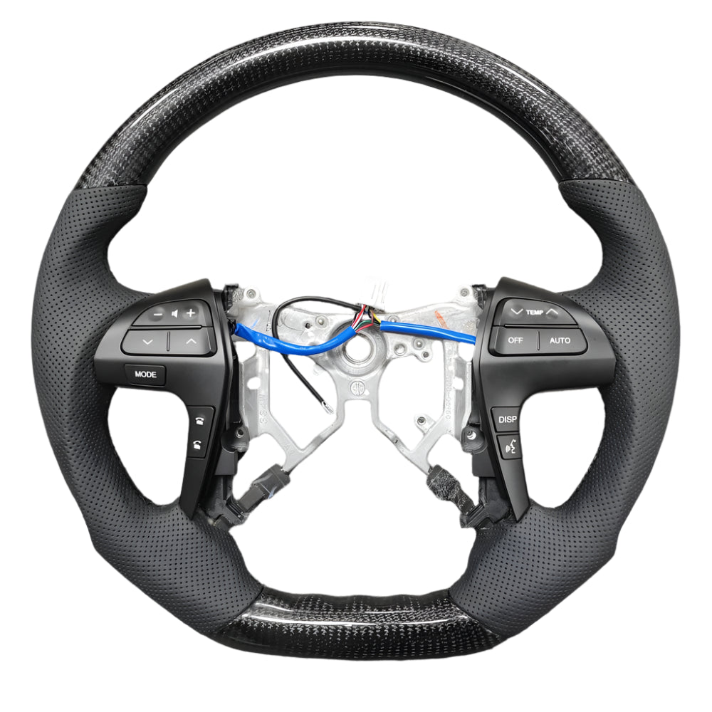 Steering wheel with wiring and components on a gray surface