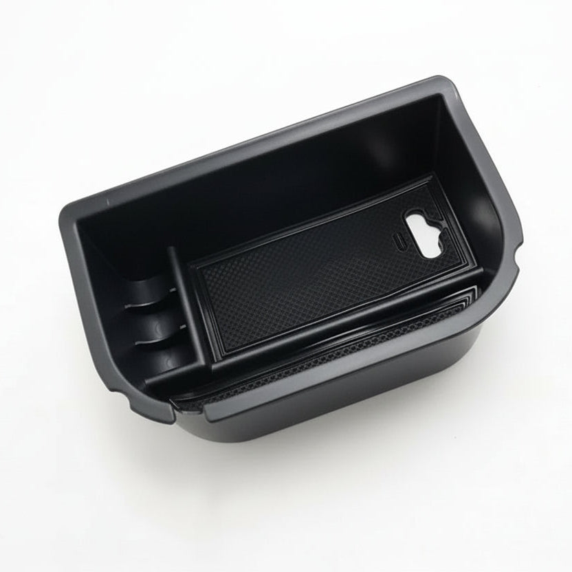 Black car storage compartment on a white background