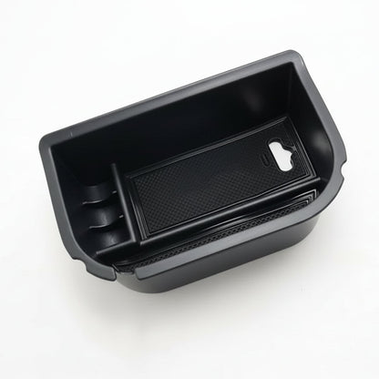 Black car storage compartment on a white background